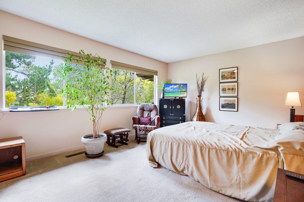 3 Forest Knoll Road Monterey, CA 93940 - Photo 51 of 63 a bedroom with furniture and a large window