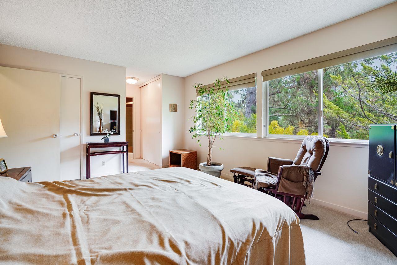 3 Forest Knoll Road Monterey, CA 93940 - Photo 52 of 63 a bedroom with a bed and a large window