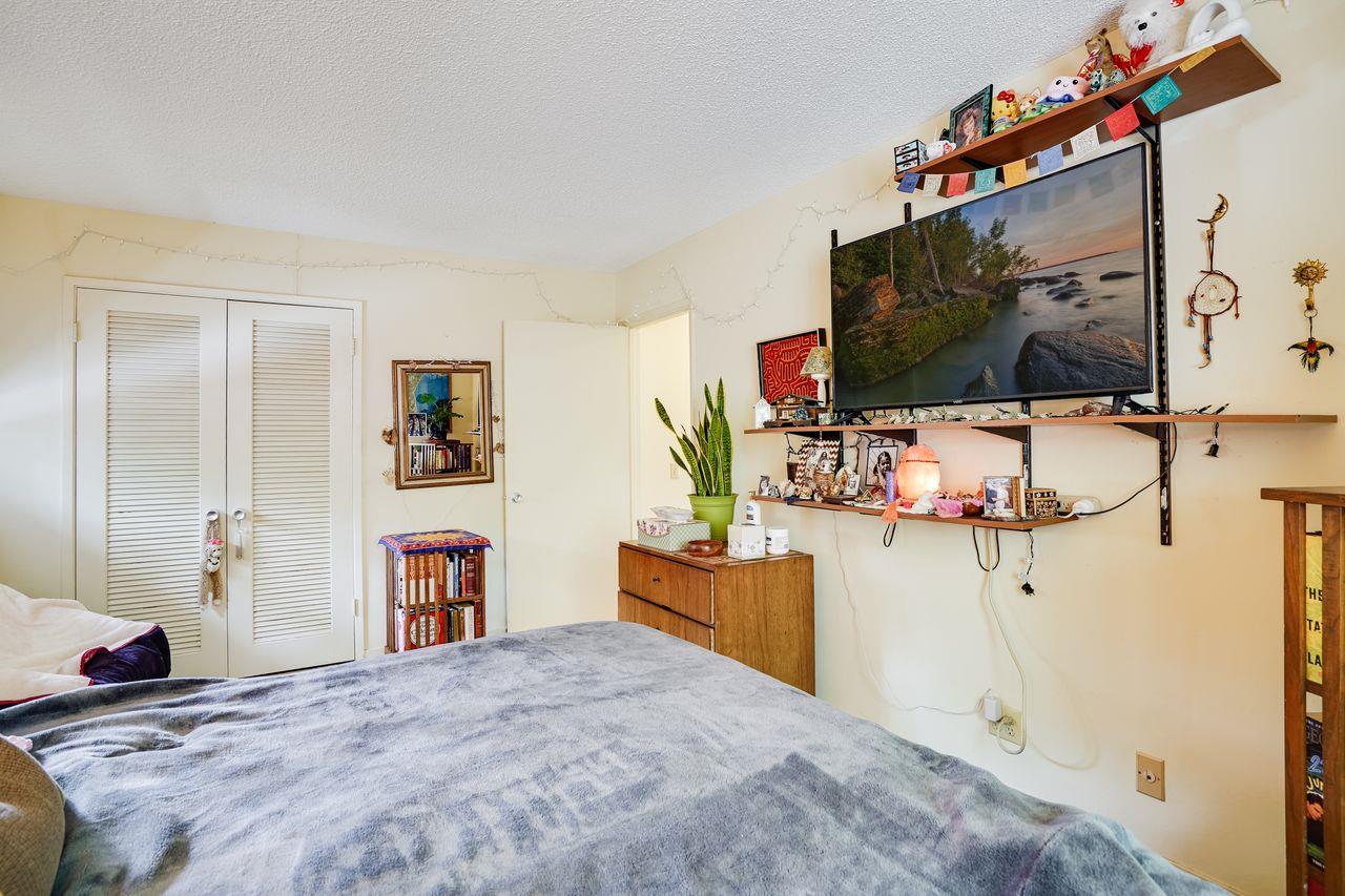 3 Forest Knoll Road Monterey, CA 93940 - Photo 55 of 63 a bedroom with a bed and flat screen tv