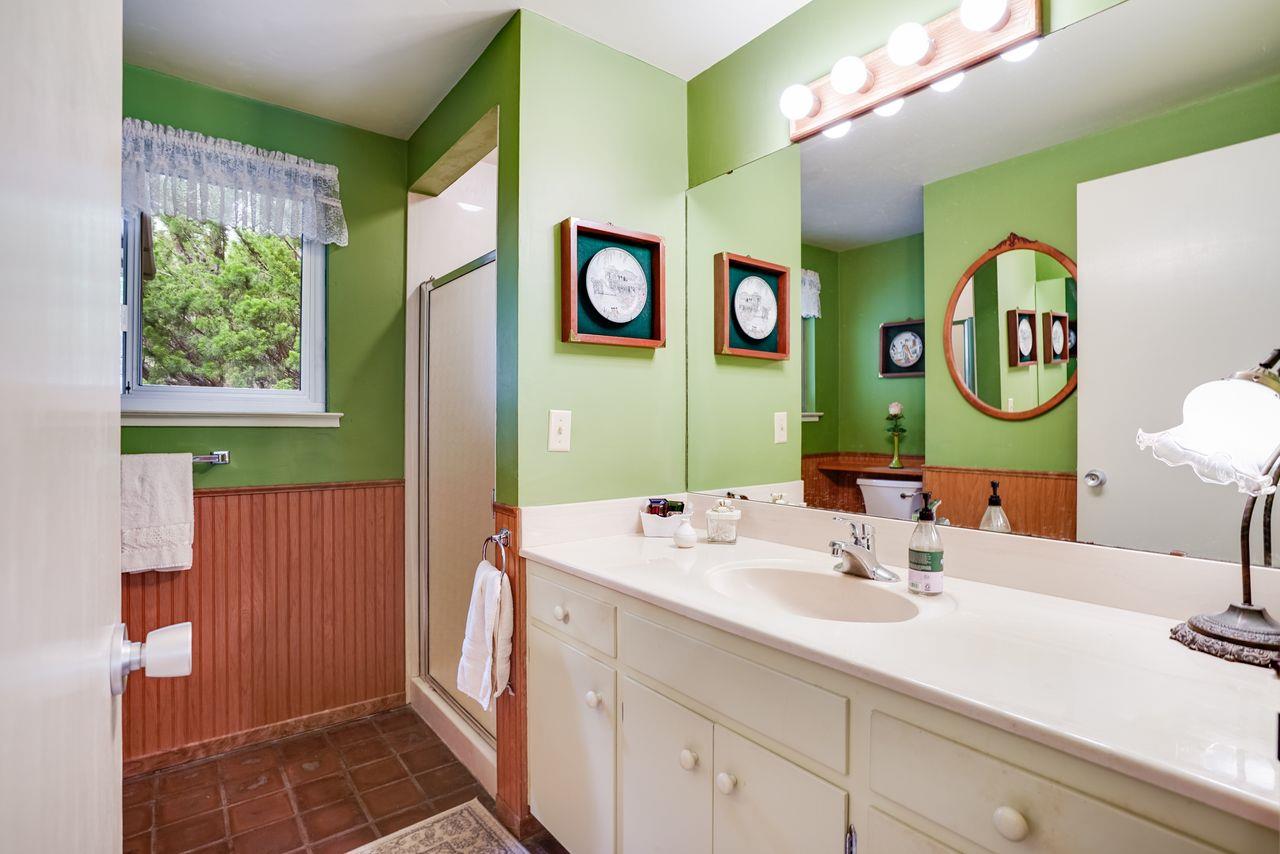 3 Forest Knoll Road Monterey, CA 93940 - Photo 56 of 63 a bathroom with a sink and a mirror