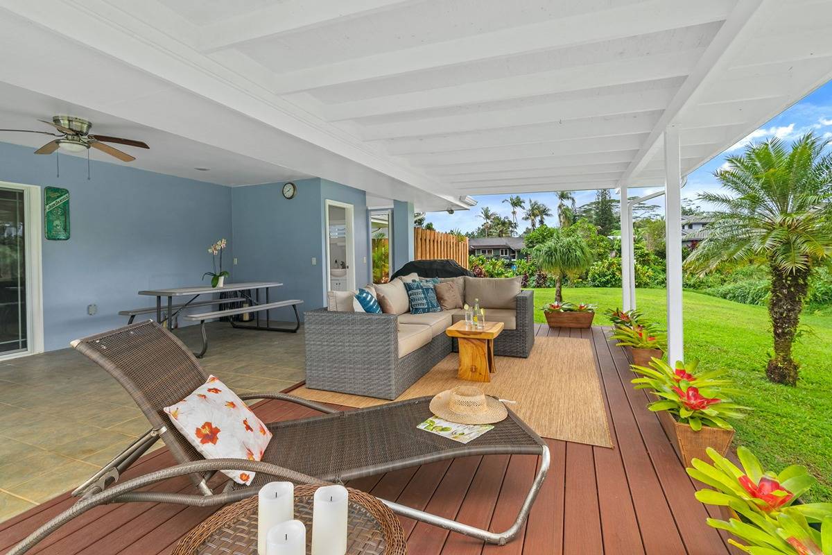 6427 Puupilo Road Kapaa, HI 96746 - Photo 2 of 27 a living room with patio furniture and a floor to ceiling window