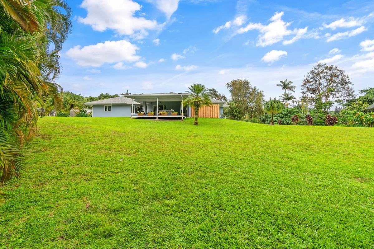 6427 Puupilo Road Kapaa, HI 96746 - Photo 25 of 27 a backyard of a house with table and chairs