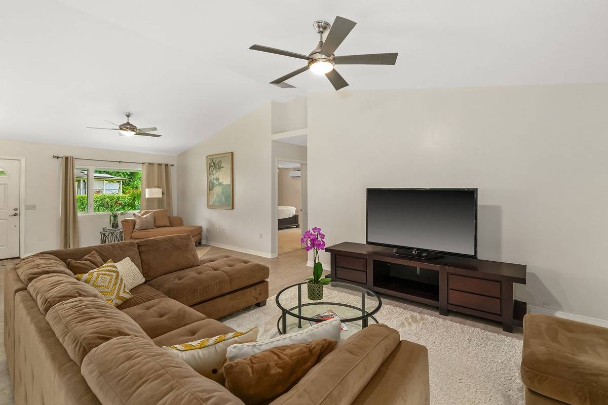6427 Puupilo Road Kapaa, HI 96746 - Photo 10 of 27 a living room with furniture and a flat screen tv