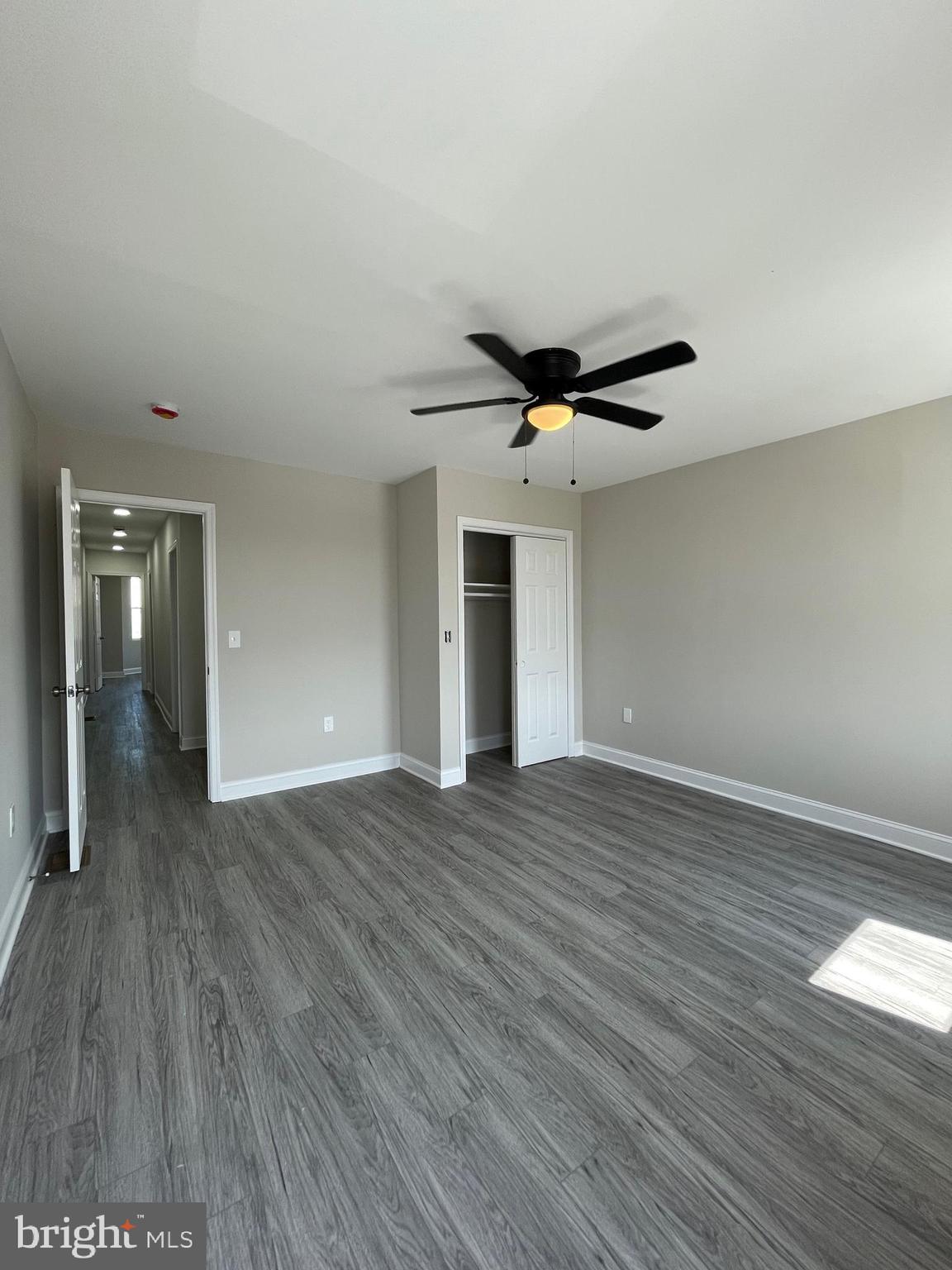 1806 East Lanvale Street Baltimore, MD 21213 - Photo 13 of 23 a view of empty room with wooden floor