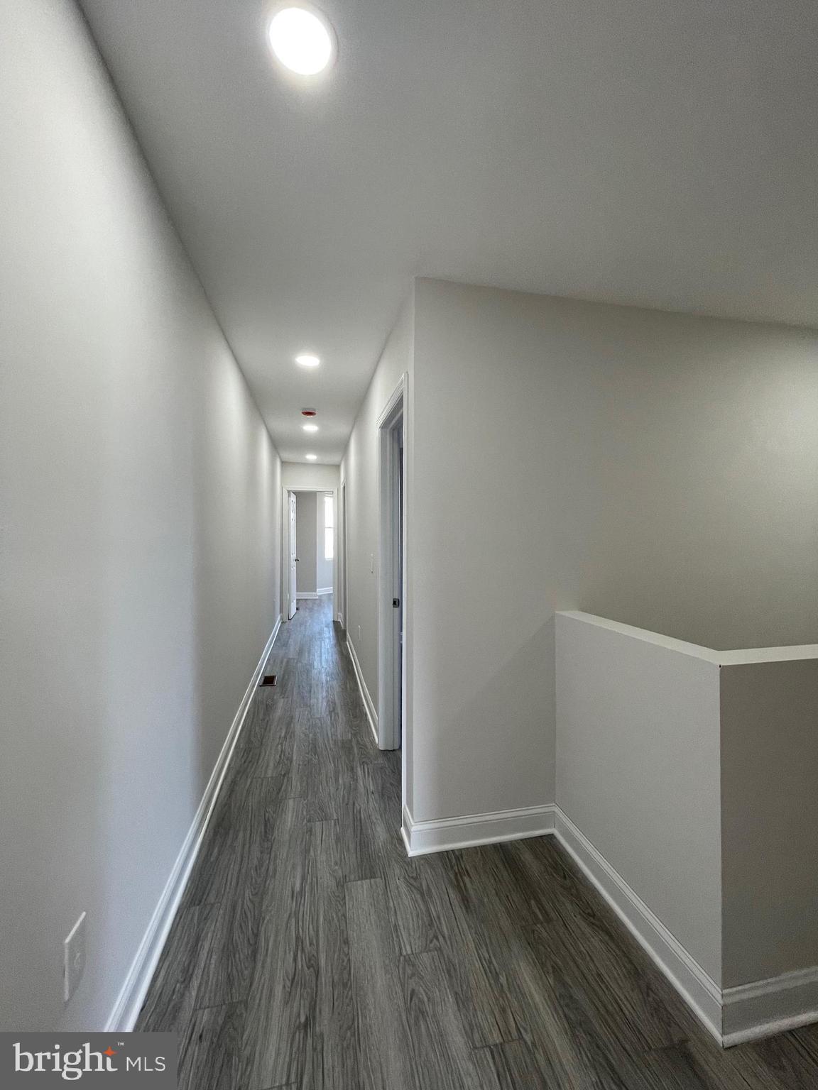 1806 East Lanvale Street Baltimore, MD 21213 - Photo 14 of 23 a view of hallway with wooden floor