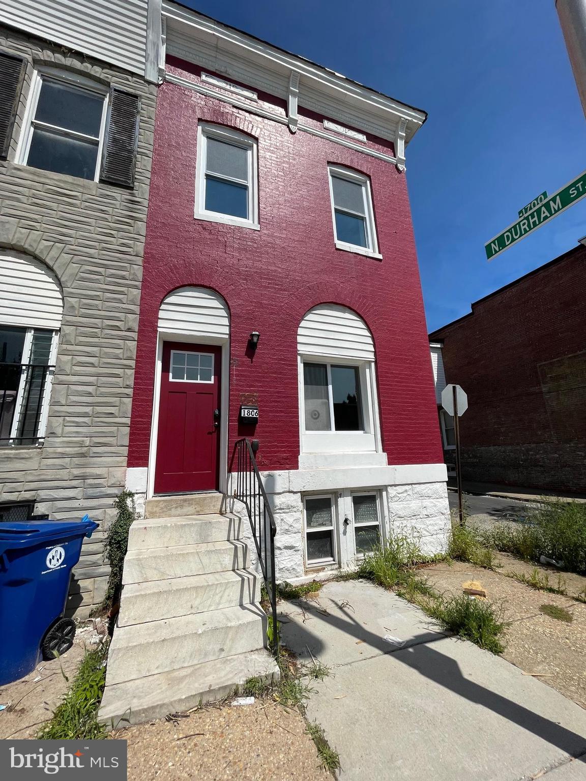 1806 East Lanvale Street Baltimore, MD 21213 - Photo 2 of 23 a front view of a house with yard