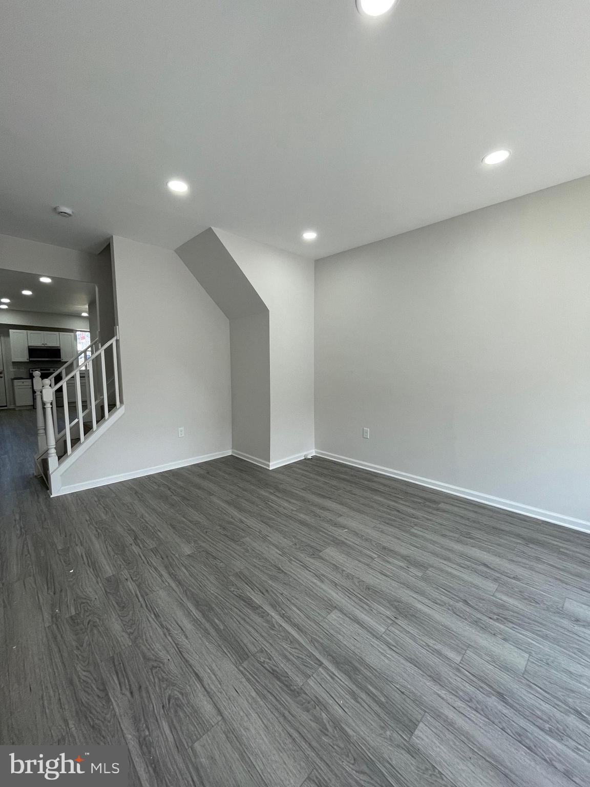 1806 East Lanvale Street Baltimore, MD 21213 - Photo 4 of 23 an empty room with wooden floor