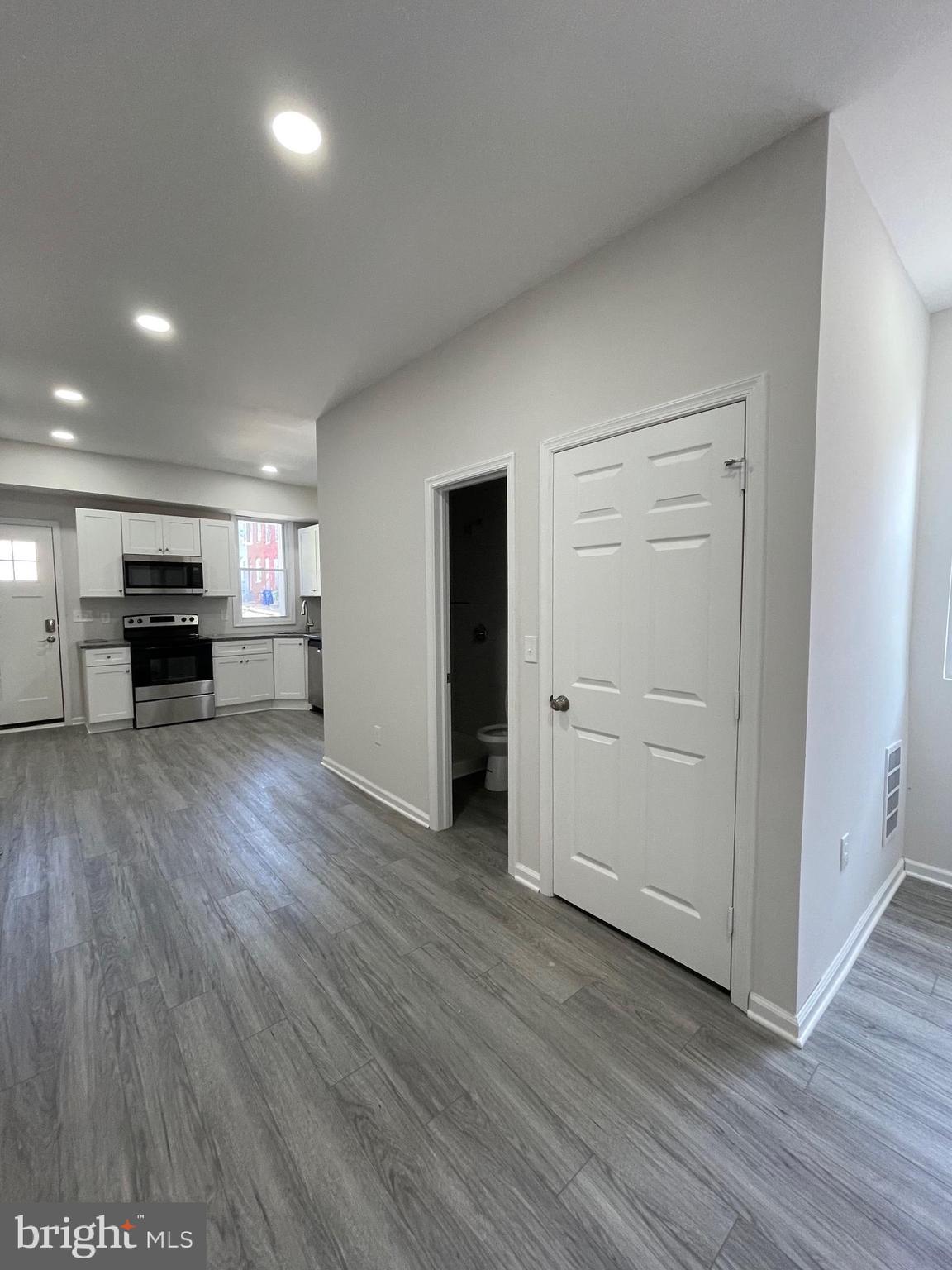 1806 East Lanvale Street Baltimore, MD 21213 - Photo 5 of 23 a view of kitchen with furniture and wooden floor