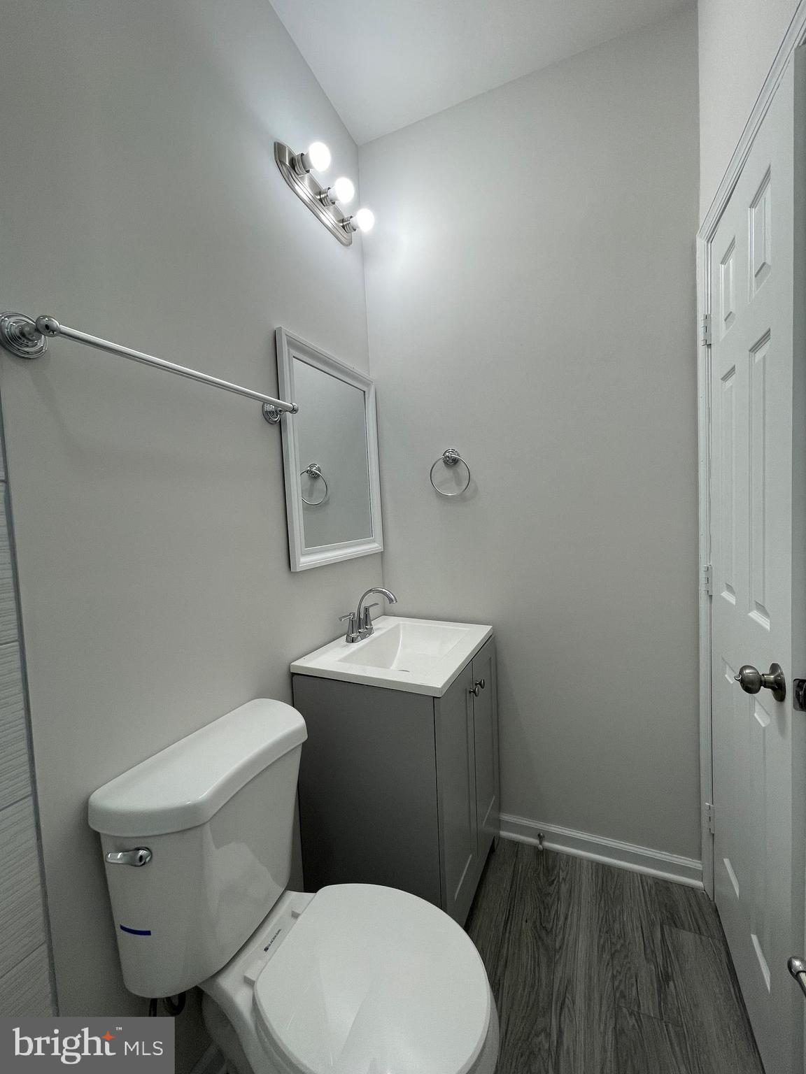 1806 East Lanvale Street Baltimore, MD 21213 - Photo 8 of 23 a white toilet sitting next to a bathroom sink