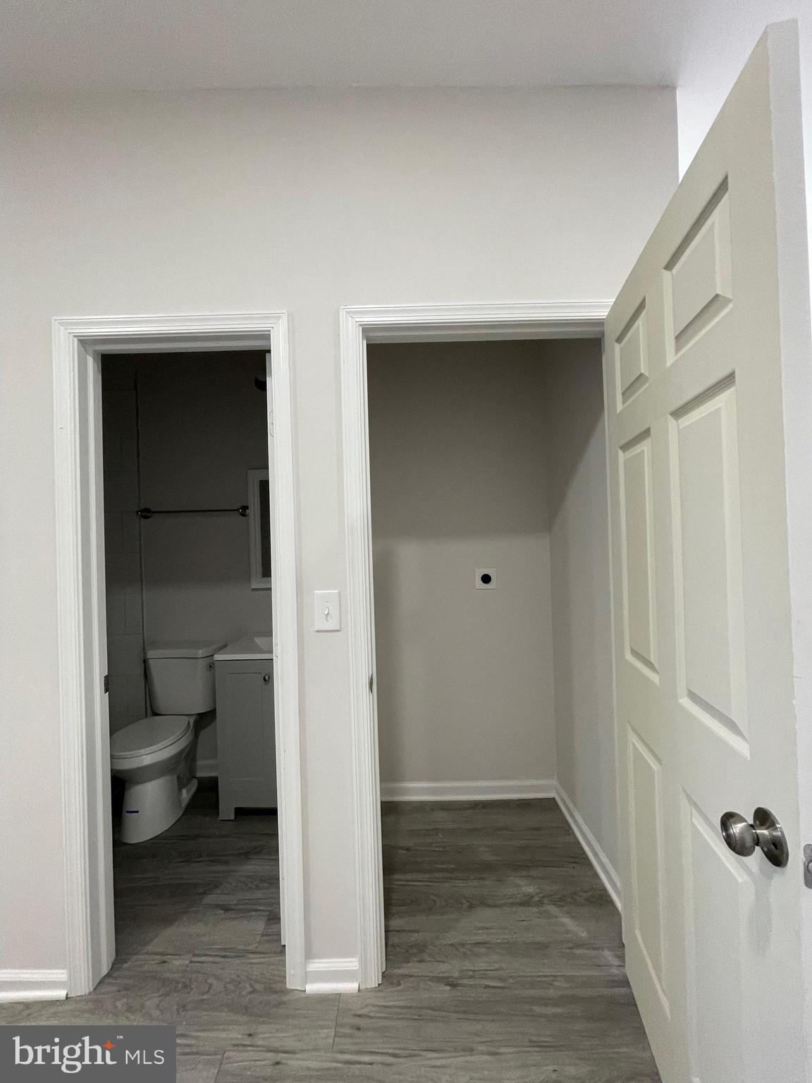 1806 East Lanvale Street Baltimore, MD 21213 - Photo 9 of 23 a bathroom view with wooden floor and a toilet