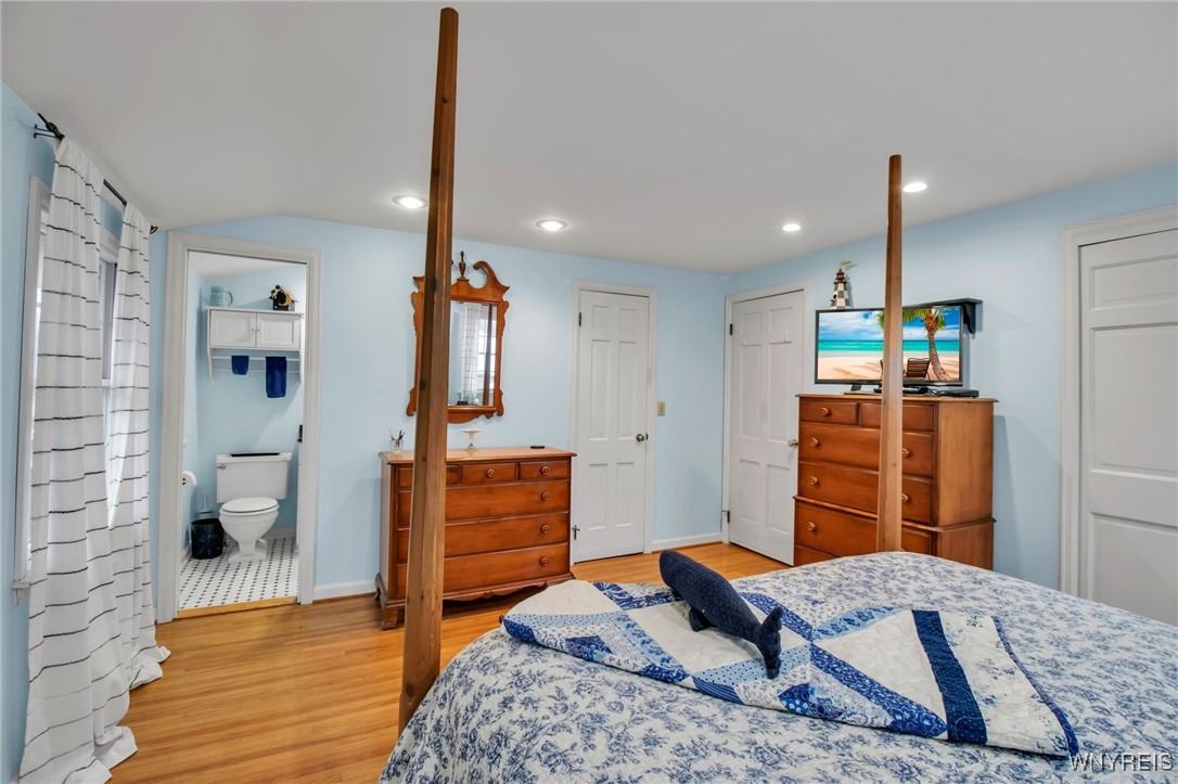 54 Surrey Amherst, NY 14221 - Photo 31 of 46 Primary bedroom with hardwood flooring, recessed l