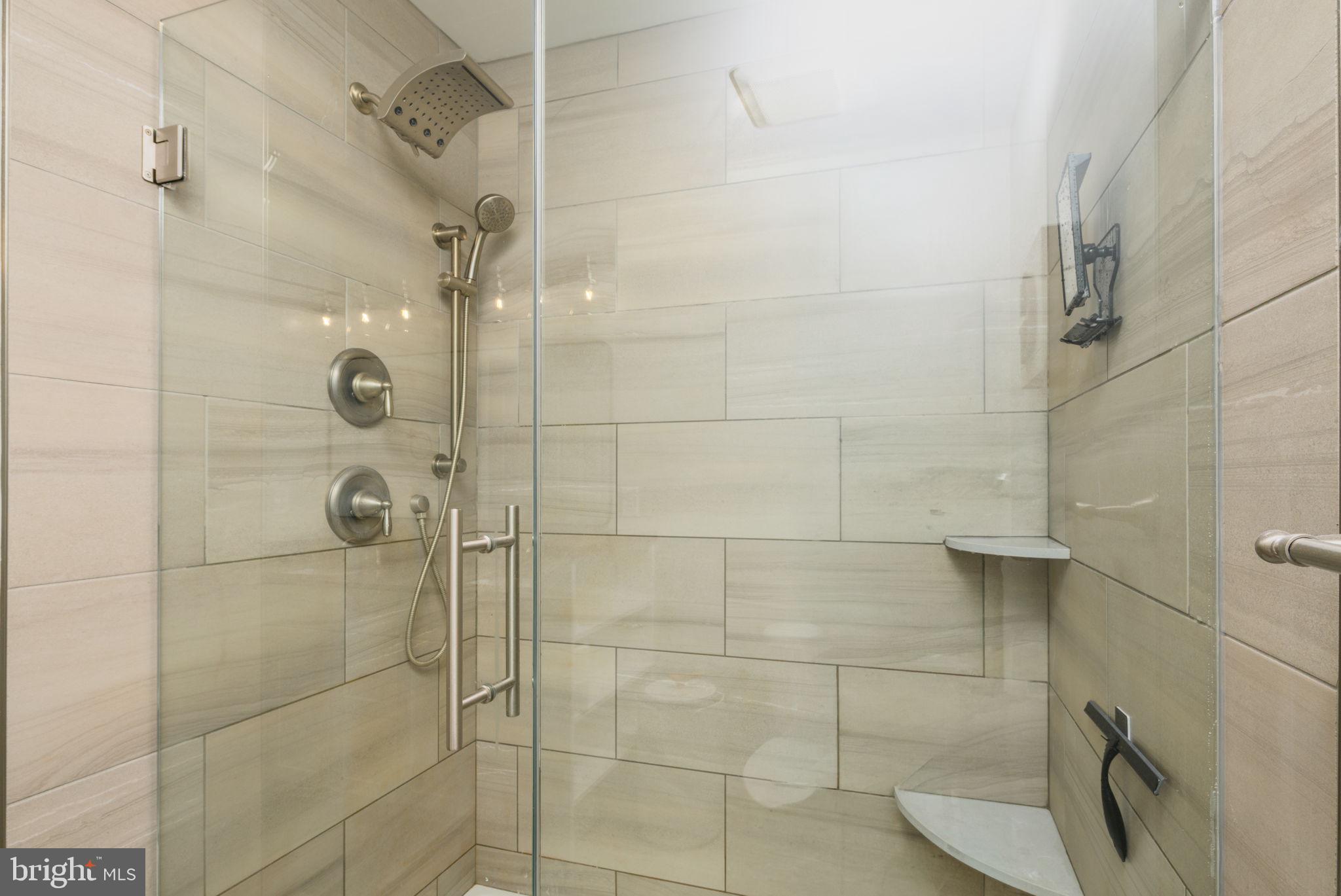 2649 Roberts Station Road Ingleside, MD 21644 - Photo 32 of 47 Sleek modern shower with elegant tiles.