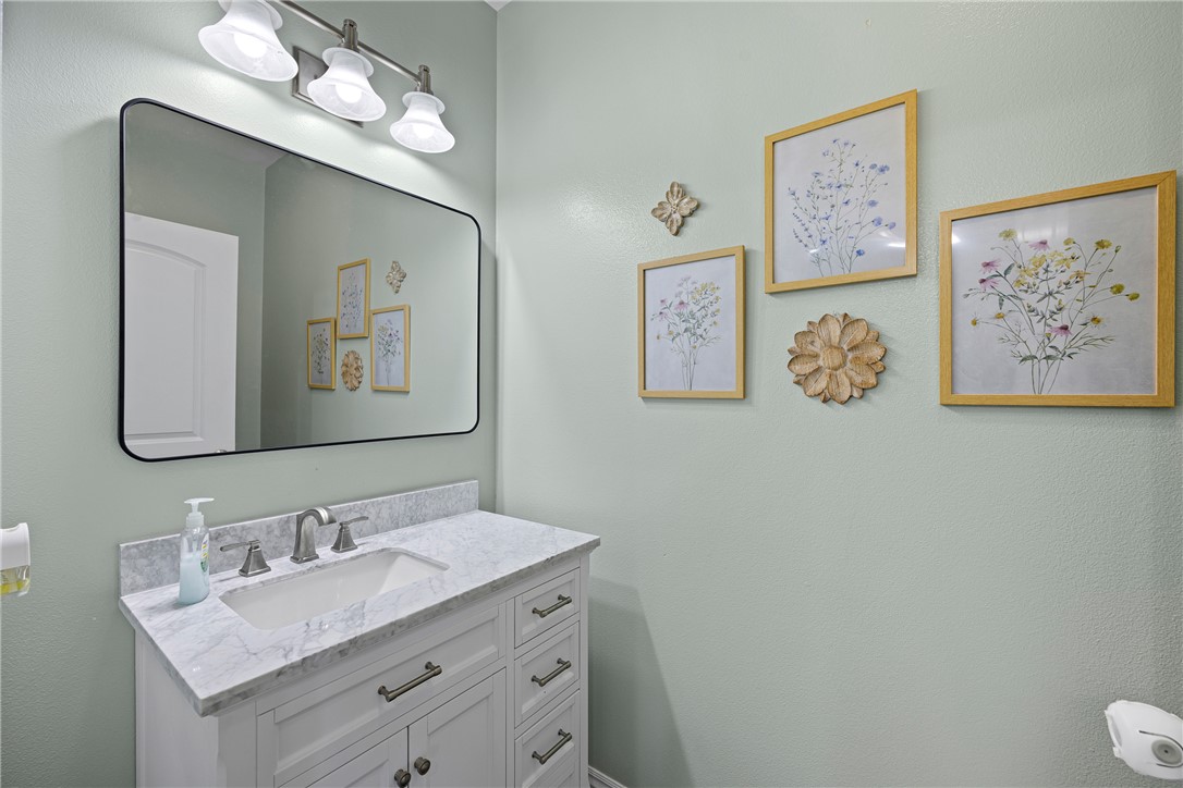 751 Walthall Road Russellville, AR 72802 - Photo 30 of 60 White vanity with a rectangular undermount sink and a light-colored countertop