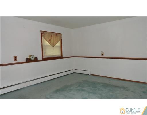 740 Old Raritan Road Edison, NJ 08820 - Photo 11 of 24 a open hall with a bench