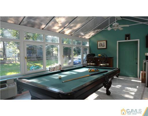 740 Old Raritan Road Edison, NJ 08820 - Photo 14 of 24 a room with pool table and windows