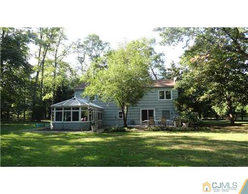 740 Old Raritan Road Edison, NJ 08820 - Photo 18 of 24 a balcony with a garden and trees