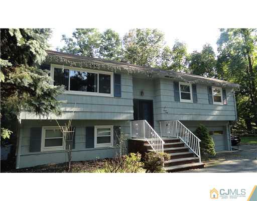 740 Old Raritan Road Edison, NJ 08820 - Photo 22 of 24 a front view of a house with a garden