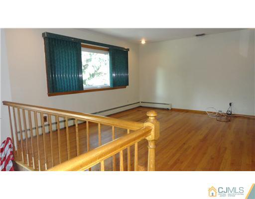740 Old Raritan Road Edison, NJ 08820 - Photo 4 of 24 a view of a living room and a window