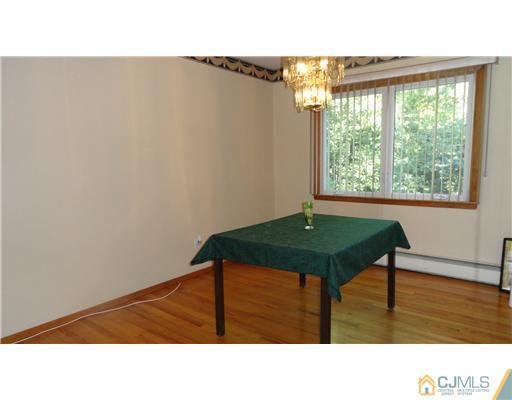 740 Old Raritan Road Edison, NJ 08820 - Photo 6 of 24 a black and white photo of a living room