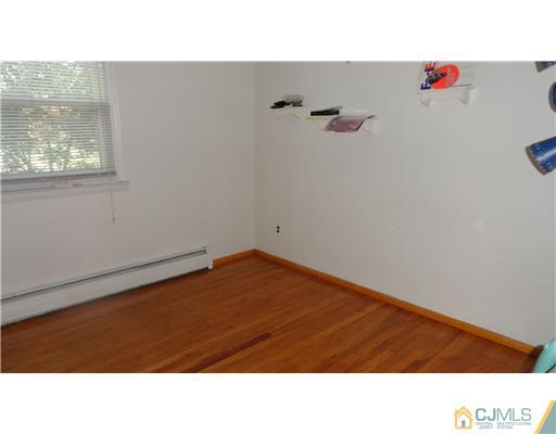 740 Old Raritan Road Edison, NJ 08820 - Photo 8 of 24 a black and white photo of a room