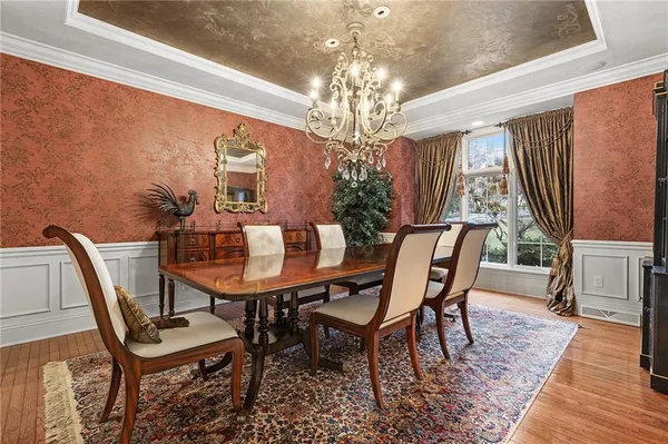 a view of a dining room with furniture window and wooden floor