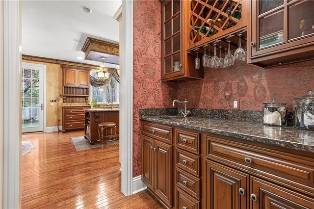 a kitchen with stainless steel appliances granite countertop a stove and cabinets