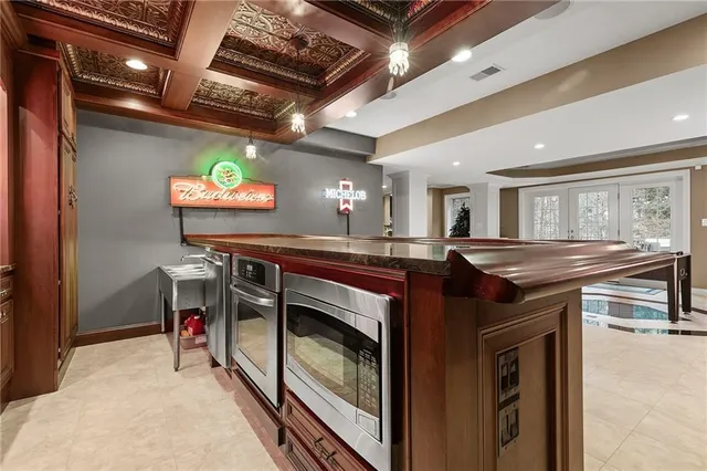 a kitchen with stainless steel appliances granite countertop a stove and cabinets