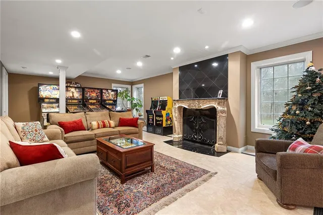 a living room with furniture and a fireplace