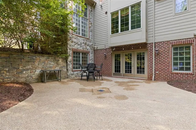 a view of a house with backyard porch and sitting area
