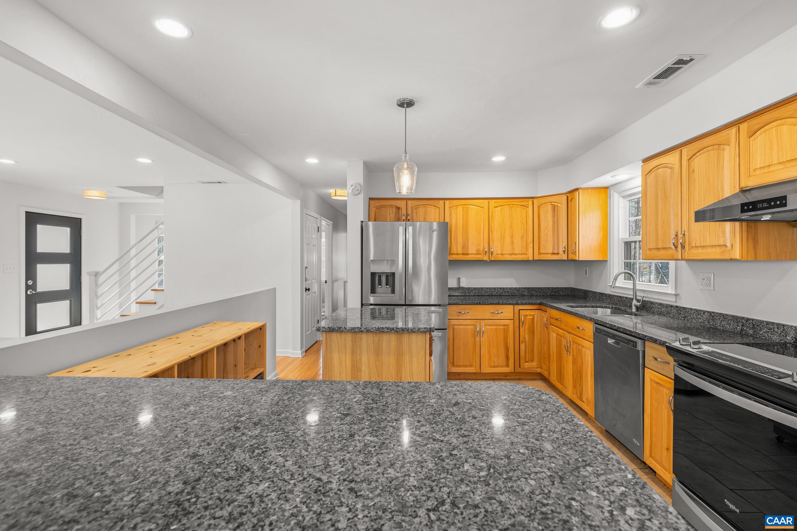 1284 Tilman Road Charlottesville, VA 22901 - Photo 16 of 36 a large kitchen with stainless steel appliances granite countertop a sink stove and refrigerator