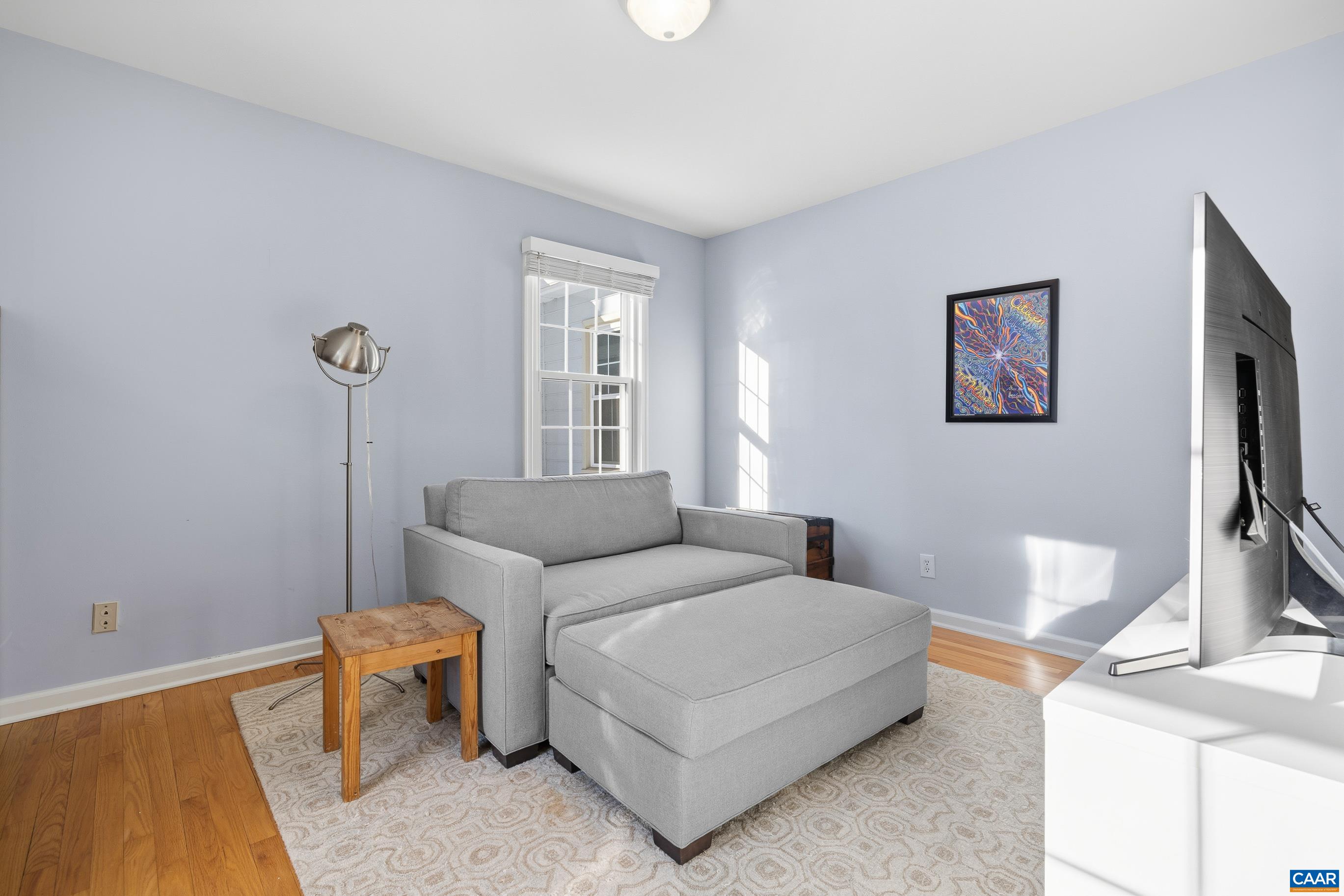 1284 Tilman Road Charlottesville, VA 22901 - Photo 17 of 36 a living room with furniture and a window