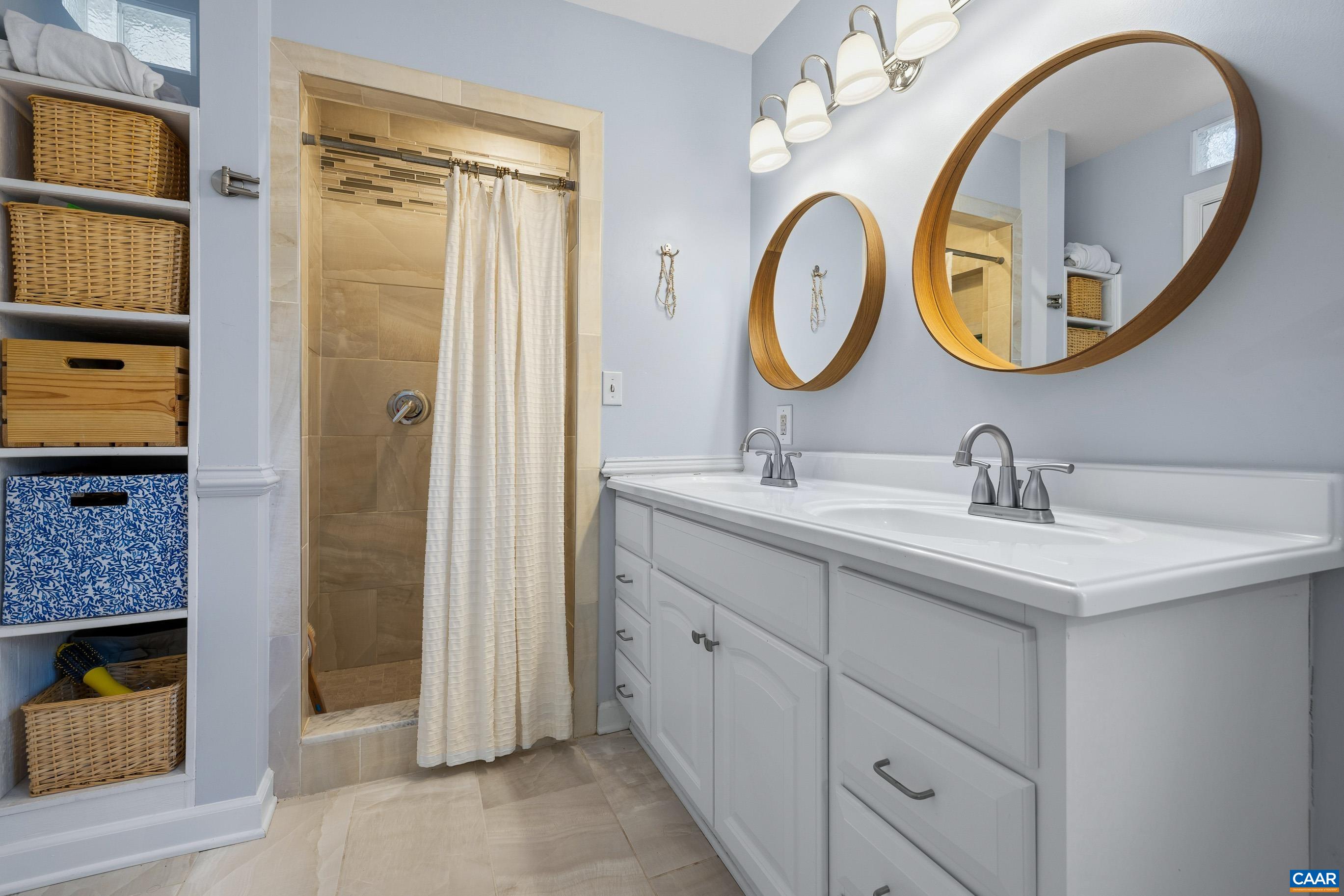 1284 Tilman Road Charlottesville, VA 22901 - Photo 21 of 36 a bathroom with a sink and a mirror