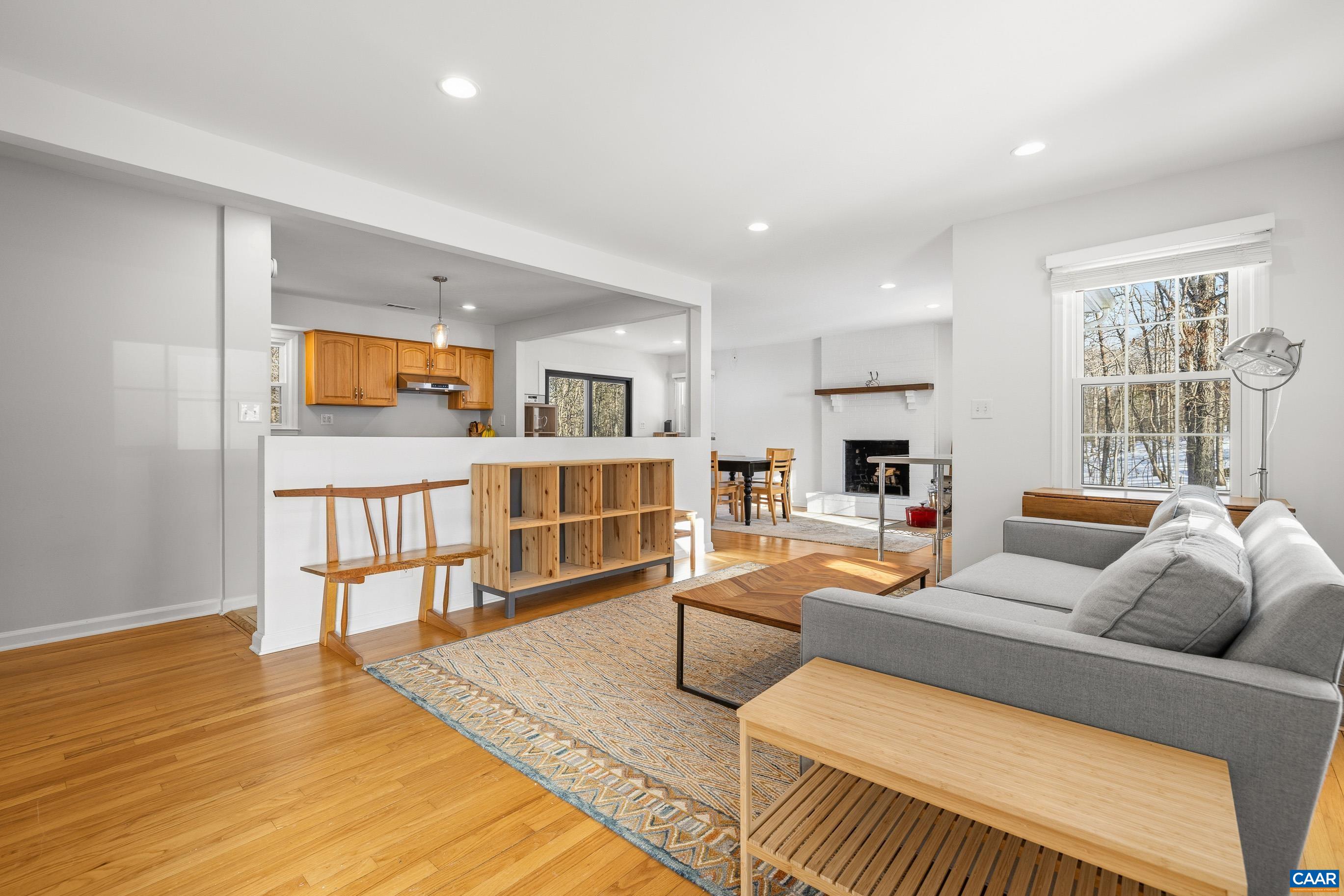1284 Tilman Road Charlottesville, VA 22901 - Photo 5 of 36 a living room with furniture and a book shelf