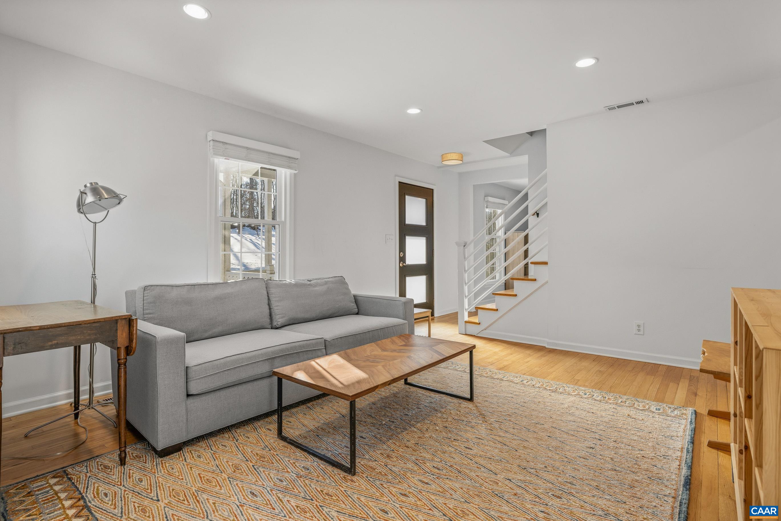 1284 Tilman Road Charlottesville, VA 22901 - Photo 6 of 36 a living room with furniture and a wooden floor
