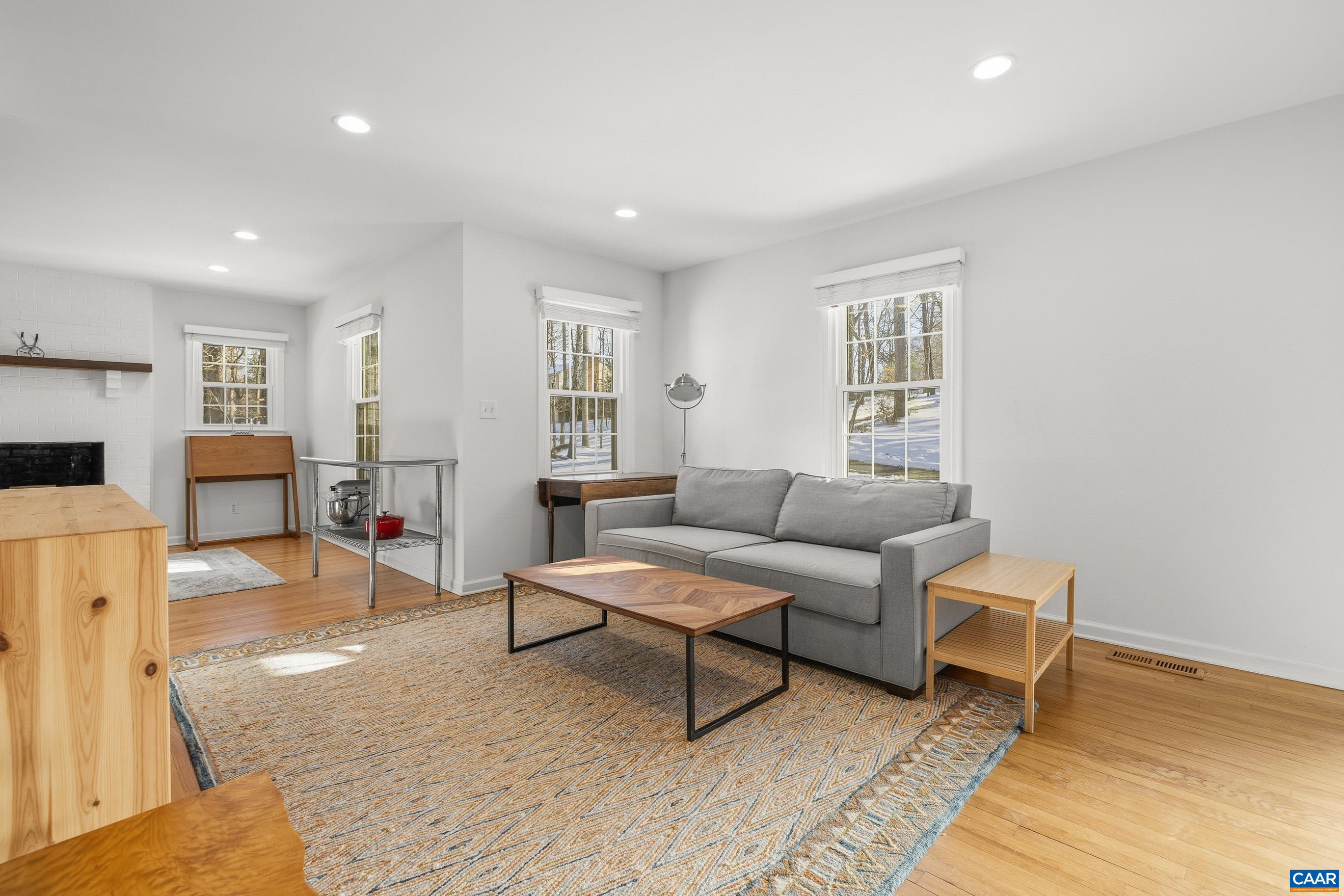 1284 Tilman Road Charlottesville, VA 22901 - Photo 7 of 36 a living room with furniture and a wooden floor