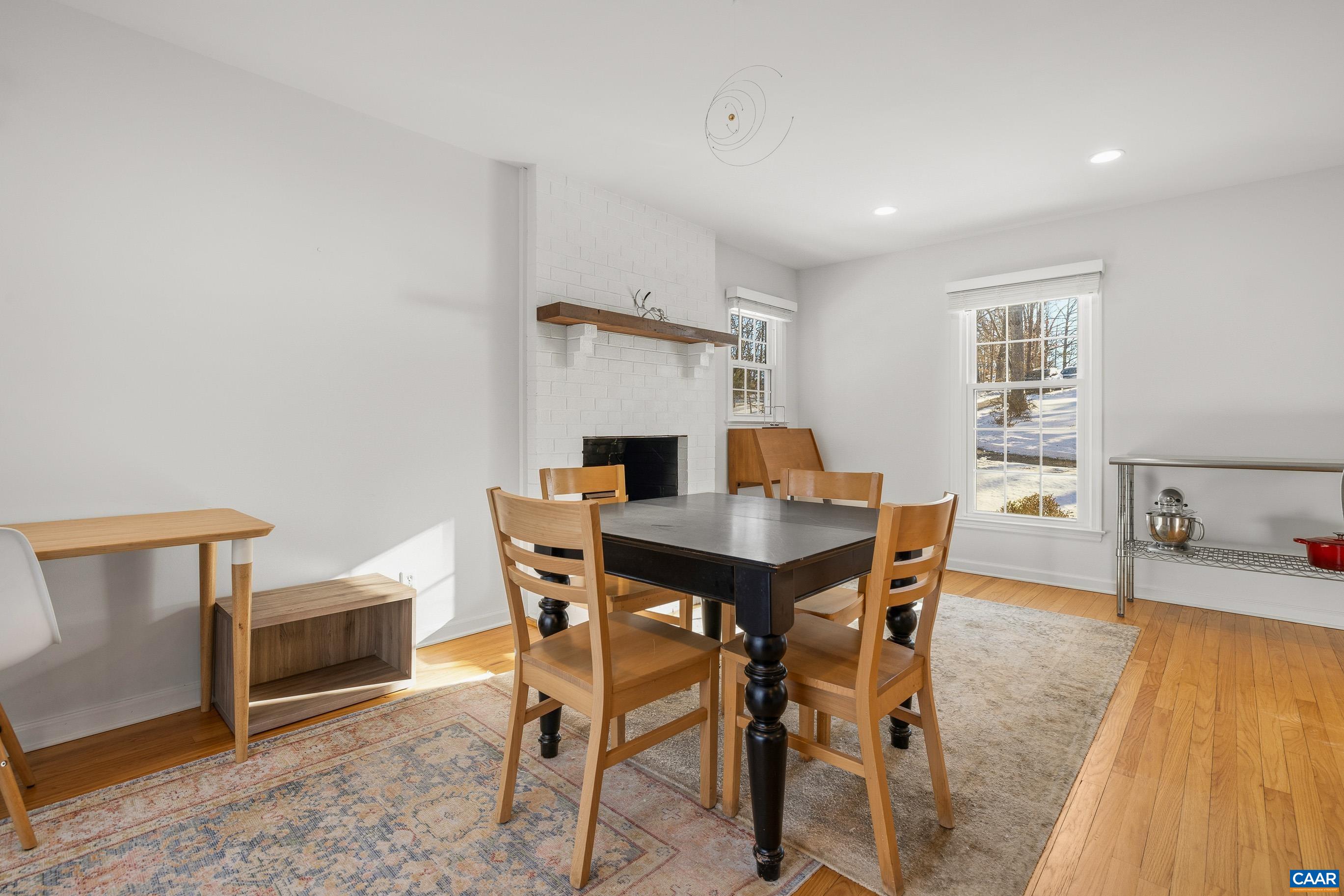 1284 Tilman Road Charlottesville, VA 22901 - Photo 10 of 36 a view of a dining room with furniture and wooden floor