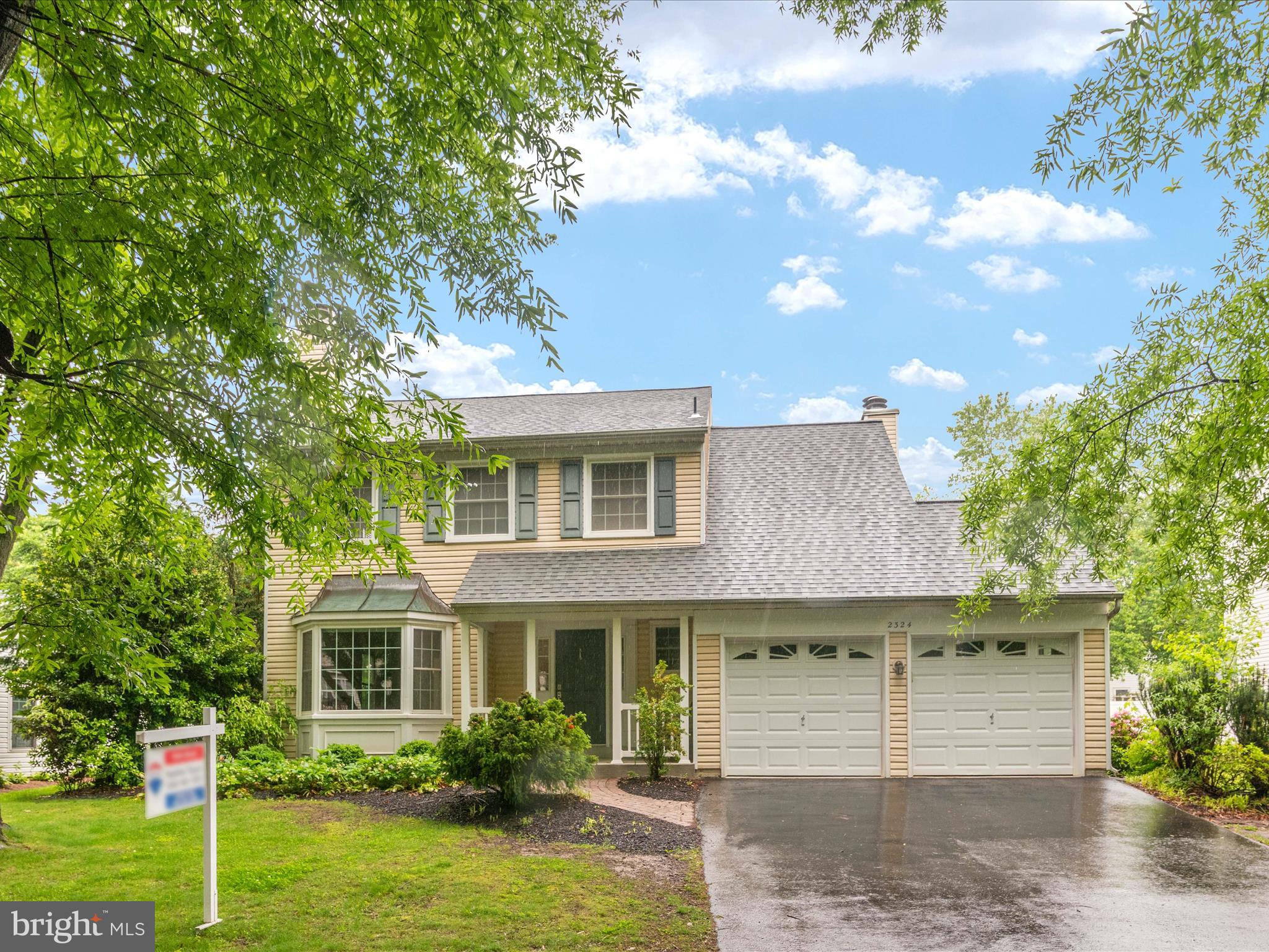 front view of a house with a yard