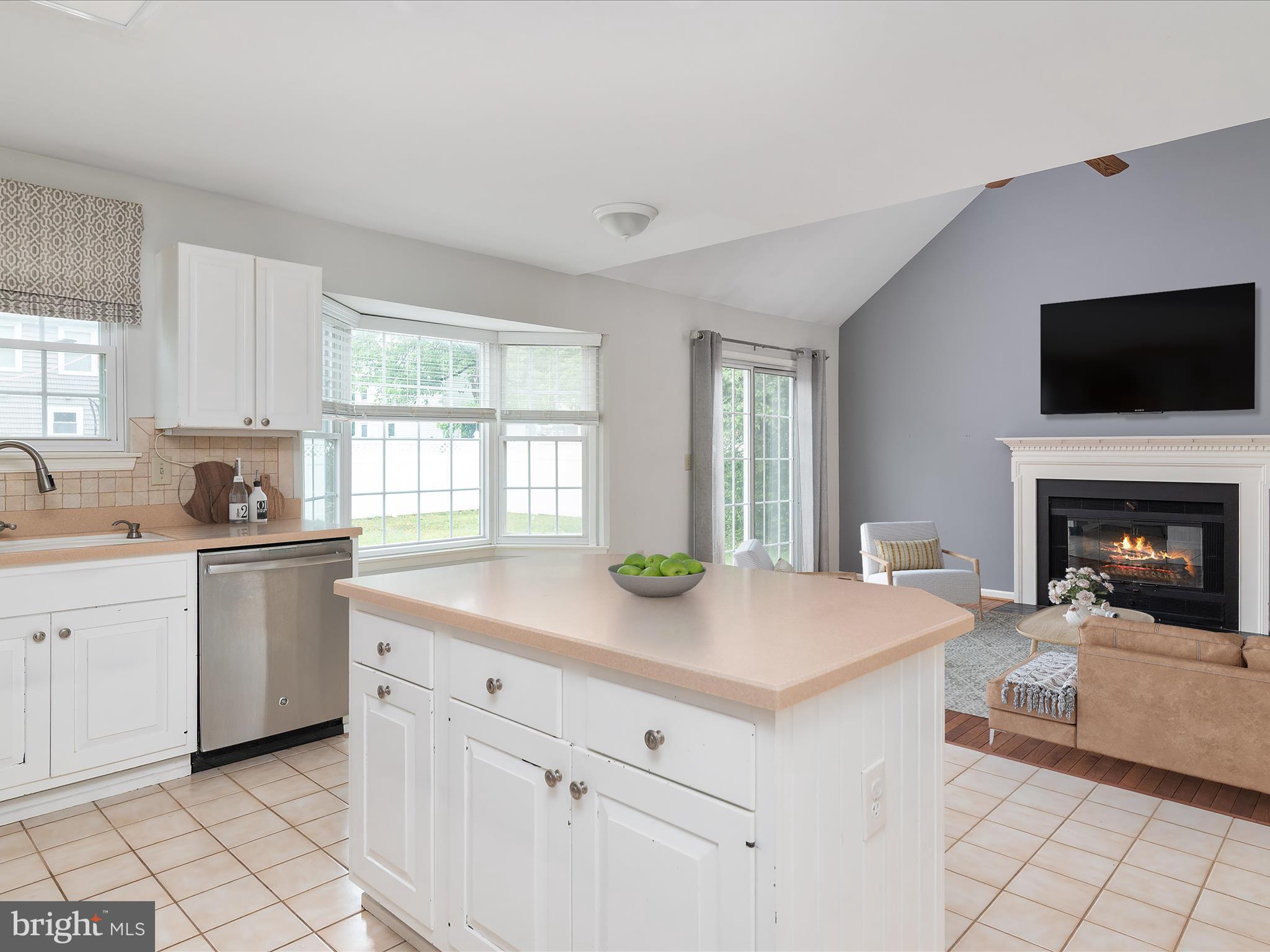 2324 Nantucket Drive Crofton, MD 21114 - Photo 14 of 63 a kitchen with sink cabinets and fireplace