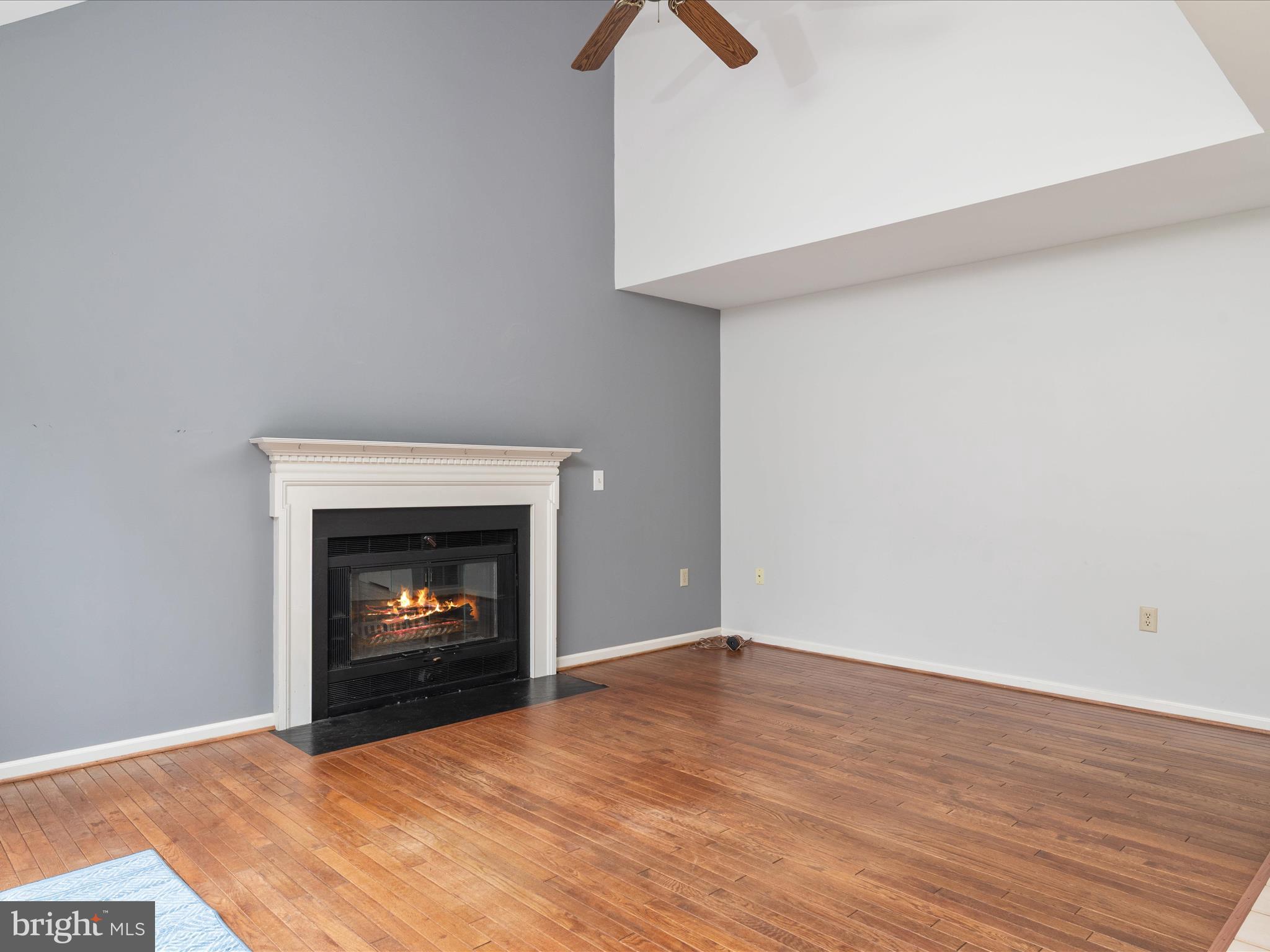 2324 Nantucket Drive Crofton, MD 21114 - Photo 20 of 63 a view of an empty room with wooden floor fireplace and a window