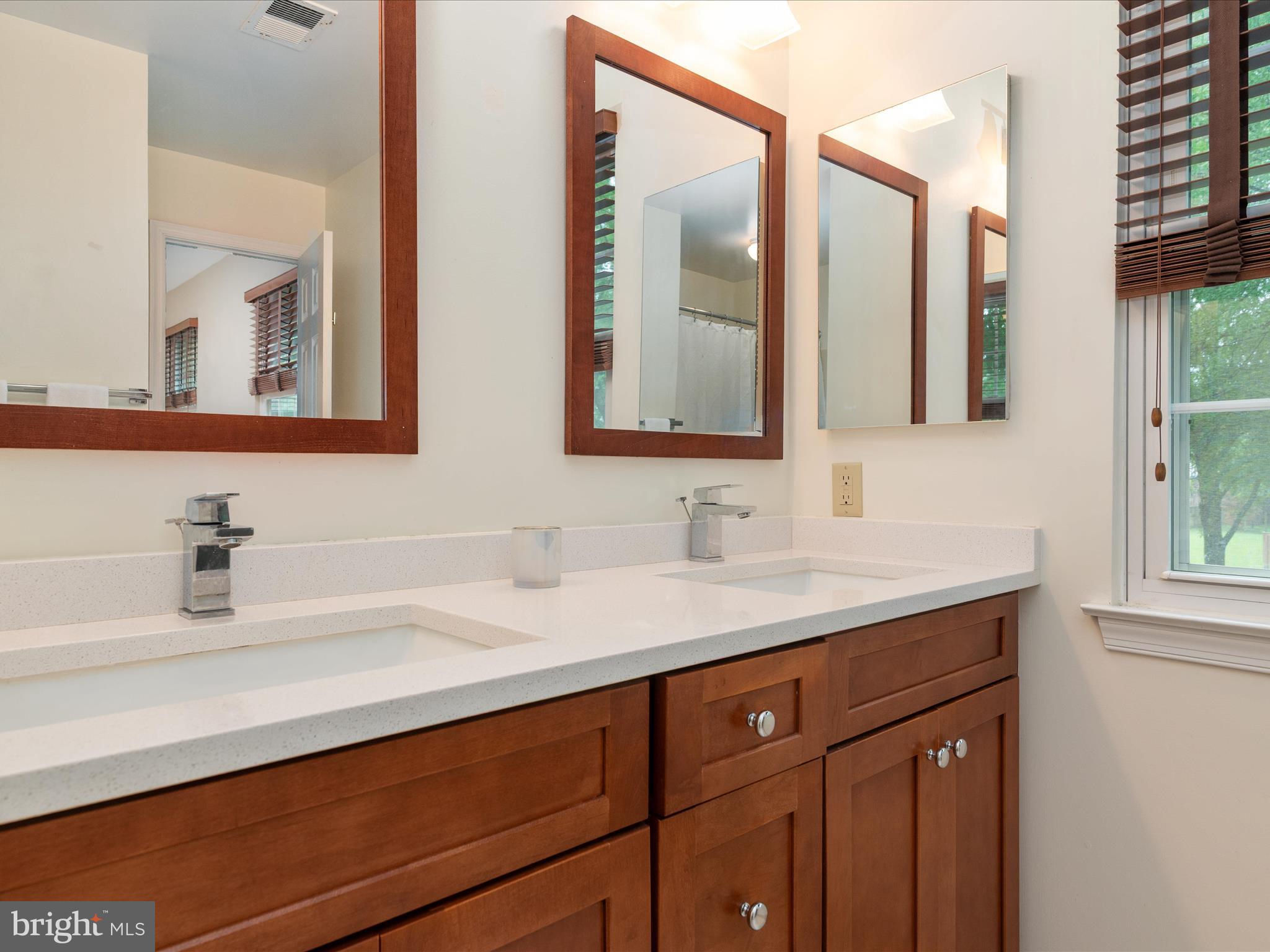 2324 Nantucket Drive Crofton, MD 21114 - Photo 25 of 63 a bathroom with a sink and a mirror