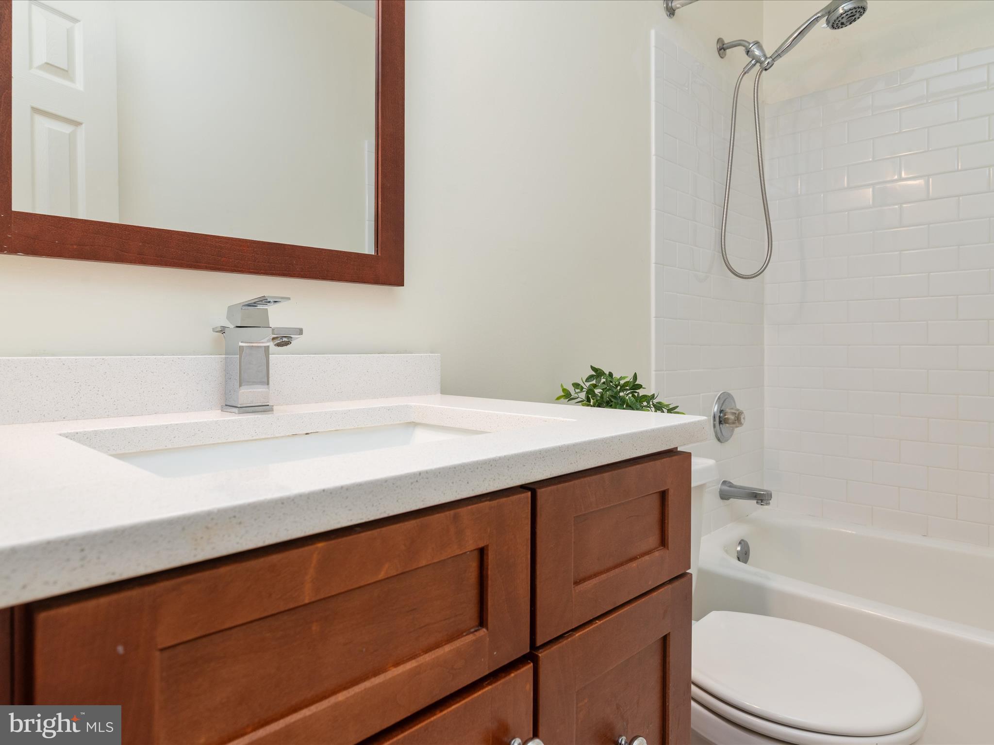 2324 Nantucket Drive Crofton, MD 21114 - Photo 32 of 63 a bathroom with a sink vanity granite toilet tub and shower