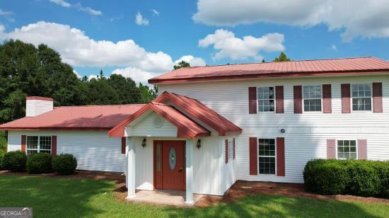 368 Miller Road Blakely, GA 39823 - Photo 1 of 1 a front view of a house with a yard and garage