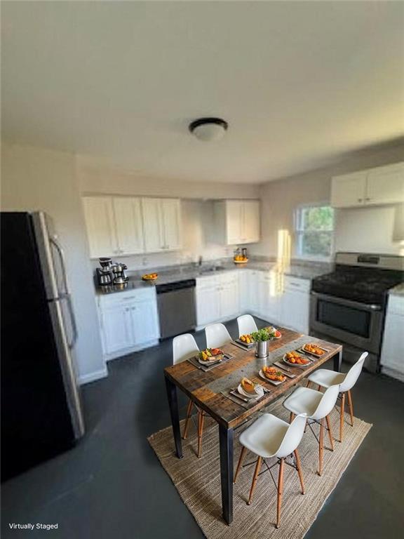 300 North Graham Street, Unit 2 Pittsburgh, PA 15206 - Photo 14 of 24 a kitchen with a dining table and chairs