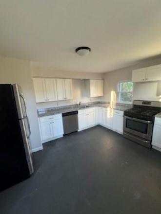 300 North Graham Street, Unit 2 Pittsburgh, PA 15206 - Photo 15 of 24 a kitchen with granite countertop a refrigerator and a stove top oven