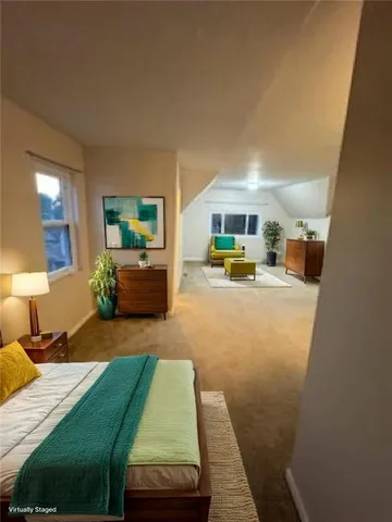 a bedroom with furniture and a wooden floor