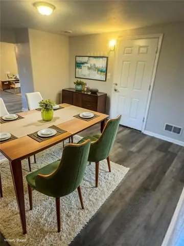 a view of a dining room with furniture