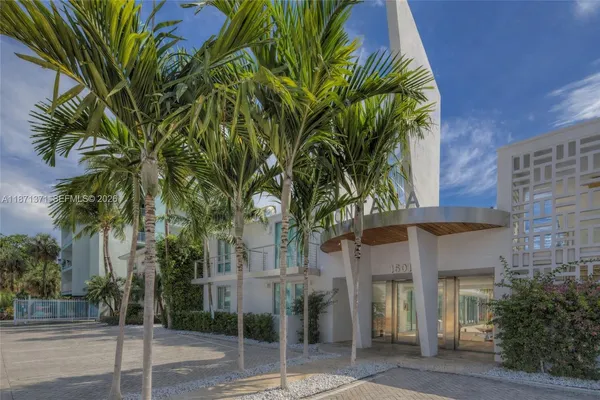 a view of a house with a tree