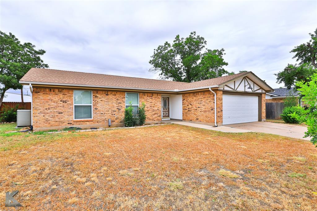 3018 Arlington Avenue Abilene, TX 79606 - Photo 1 of 1 a front view of a house with a garden and yard