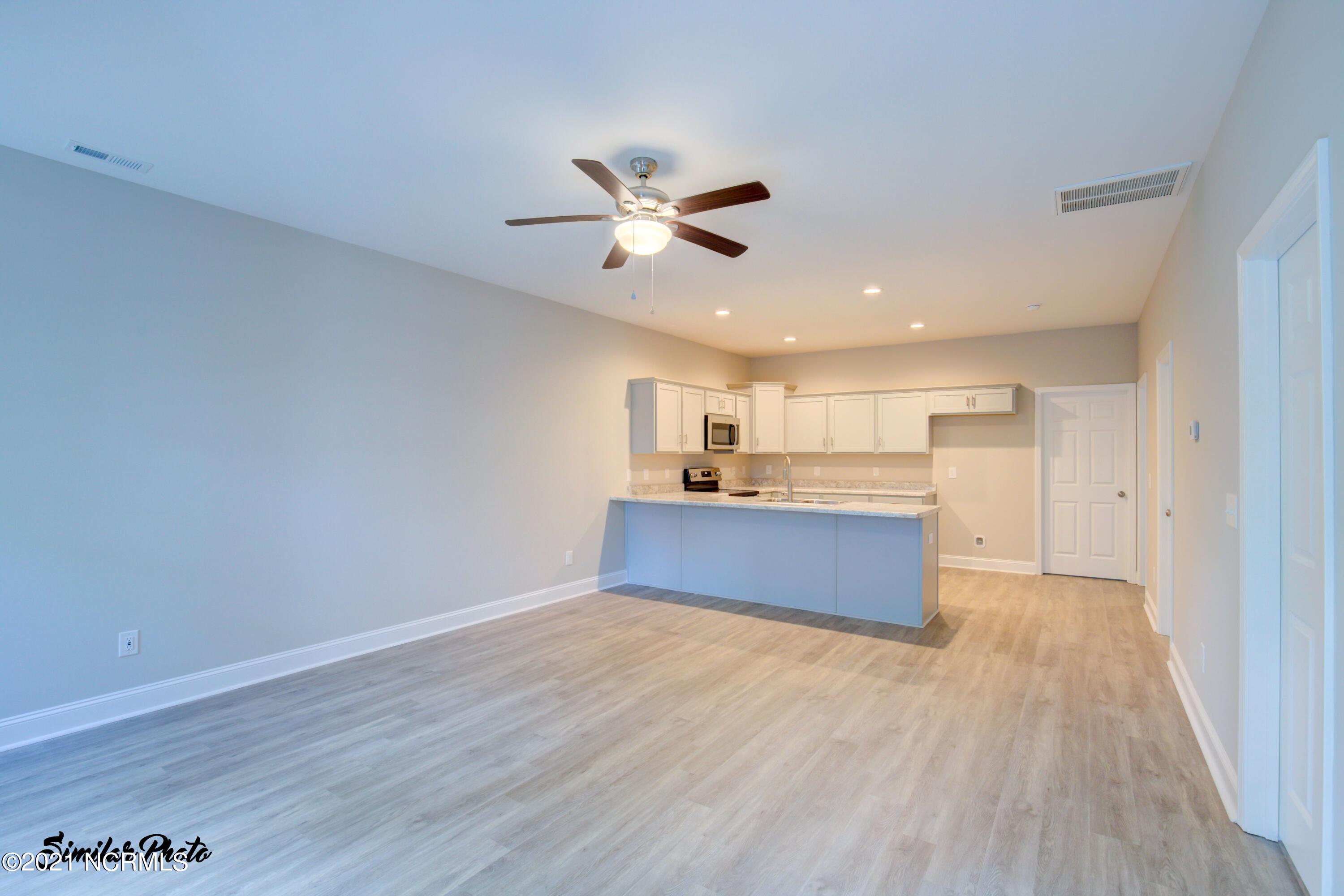 428 Guppy Loop Road Sneads Ferry, NC 28460 - Photo 9 of 24 7 - LivingKitchen (end)