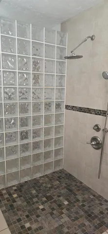 a view of a room with furniture and window